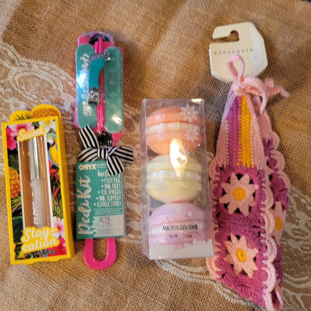 Lot of 4 girl essentials bath bombs, lip gloss, mani/pedi hair wrap